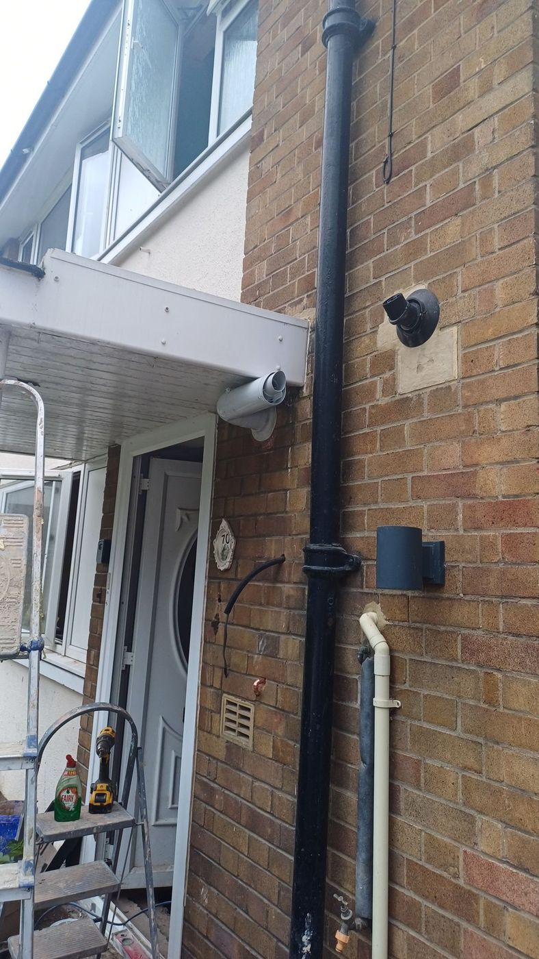 Boiler flue terminal and copper pipe run on an external wall