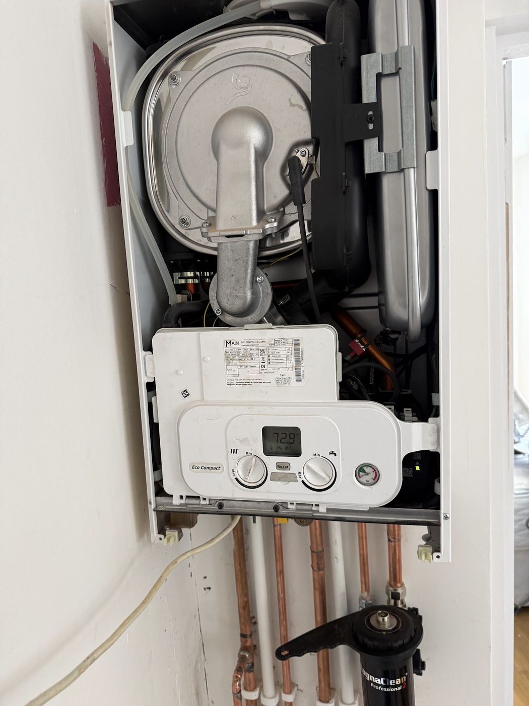Main Eco Compact boiler opened for servicing with magnetic filter below